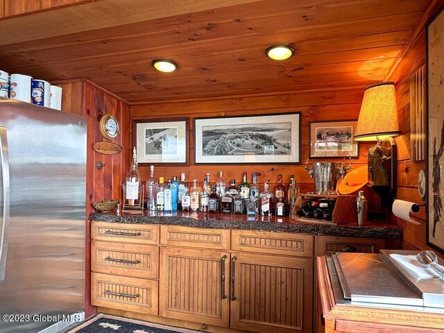 9667 Lake Shore Dr, Hague, NY 12836 - indoor dry bar featuring freestanding refrigerator, wood ceiling, and wooden walls