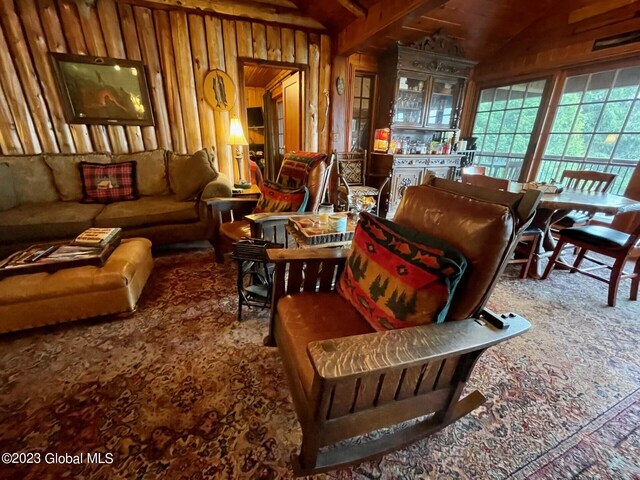 9667 Lake Shore Dr, Hague, NY 12836 - sitting room with carpet flooring and wood walls