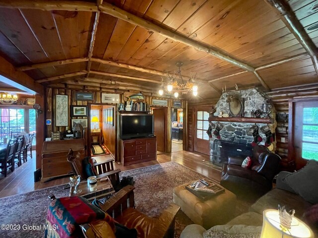 9667 Lake Shore Dr, Hague, NY 12836 - living room featuring wooden ceiling, hardwood / wood-style flooring, a chandelier, and a stone fireplace