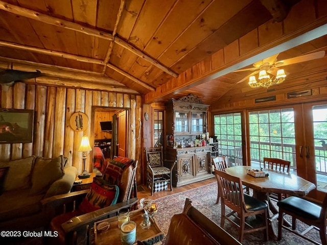 9667 Lake Shore Dr, Hague, NY 12836 - dining space featuring wood ceiling, wood walls, wood finished floors, healthy amount of natural light, and a chandelier