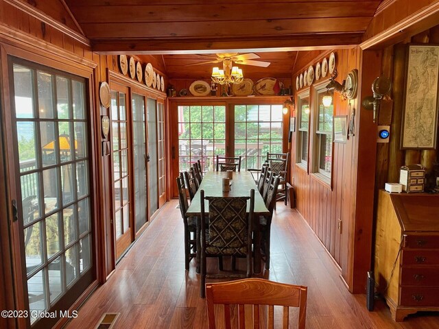 9667 Lake Shore Dr, Hague, NY 12836 - dining area featuring wooden walls, hardwood / wood-style flooring, wooden ceiling with exposed beams, and a chandelier
