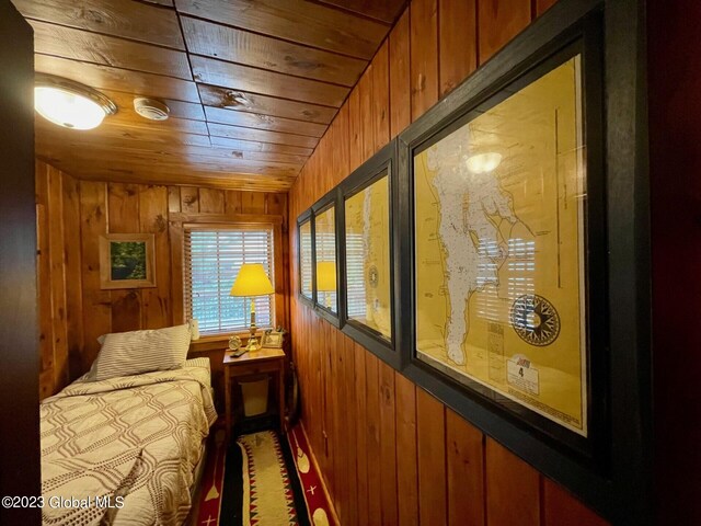 9667 Lake Shore Dr, Hague, NY 12836 - bedroom featuring wooden walls and wooden ceiling