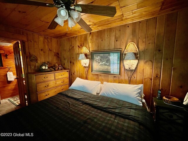 9667 Lake Shore Dr, Hague, NY 12836 - bedroom featuring wood walls, wood ceiling, and a ceiling fan