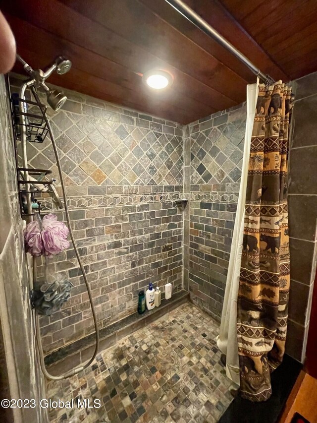 9667 Lake Shore Dr, Hague, NY 12836 - full bathroom featuring wood ceiling, tiled shower, and recessed lighting