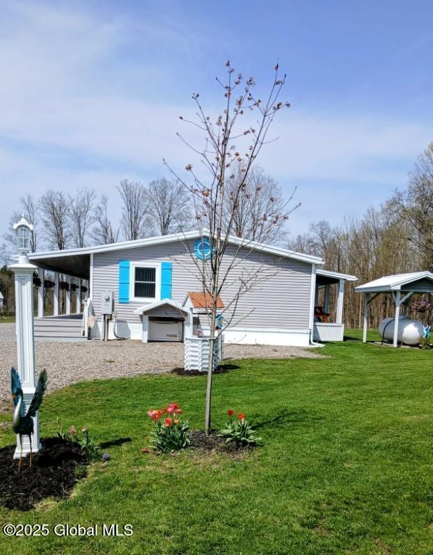 612 Oswegatchie Rd, Palatine, NY 13428 - rear view of house with a yard
