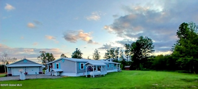 612 Oswegatchie Rd, Palatine, NY 13428 - view of front facade with a garage and a lawn