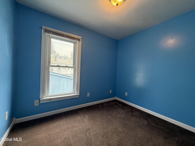 294 Main St, Hudson Falls, NY 12839 - empty room with dark colored carpet and baseboards