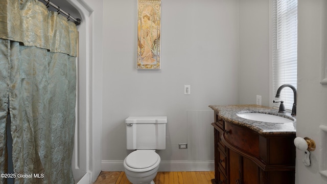 6 Eileen Dr, East Greenbush, NY 12144 - bathroom featuring baseboards, toilet, wood finished floors, vanity, and a shower with curtain