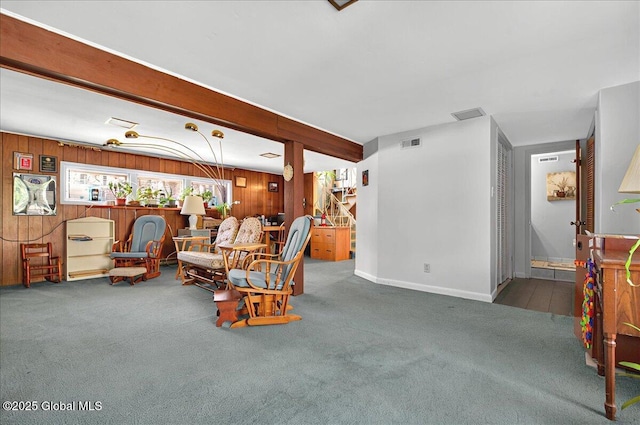 53 Harmon Rd, Glenville, NY 12302 - carpeted living room featuring wooden walls, baseboards, and beamed ceiling