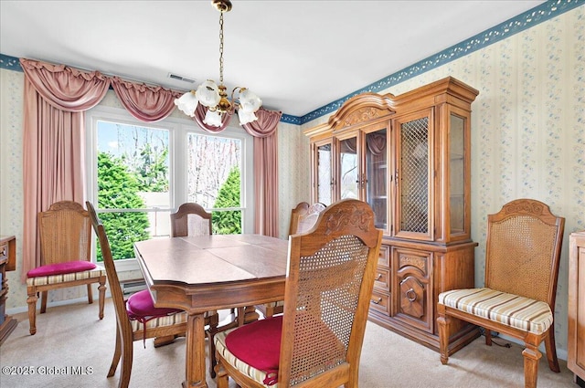 53 Harmon Rd, Glenville, NY 12302 - dining room featuring wallpapered walls, a chandelier, light colored carpet, and plenty of natural light