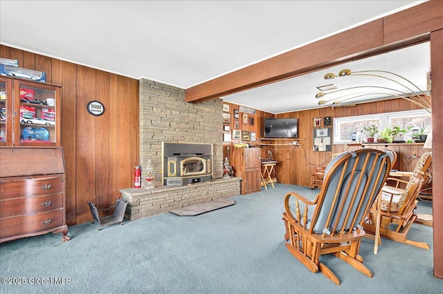 53 Harmon Rd, Glenville, NY 12302 - living area with wooden walls, carpet flooring, a wood stove, and beamed ceiling