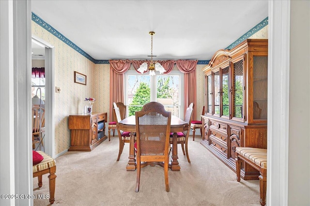 53 Harmon Rd, Glenville, NY 12302 - dining room featuring wallpapered walls, a chandelier, plenty of natural light, and light colored carpet