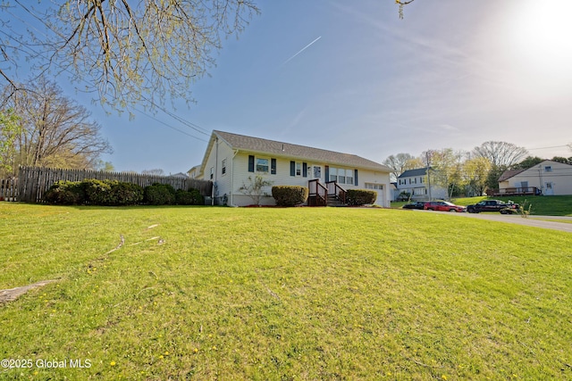 view of front of property with fence and a front yard