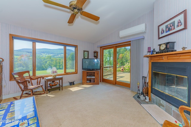 interior space with vaulted ceiling, a fireplace with flush hearth, a wall mounted air conditioner, wallpapered walls, and carpet