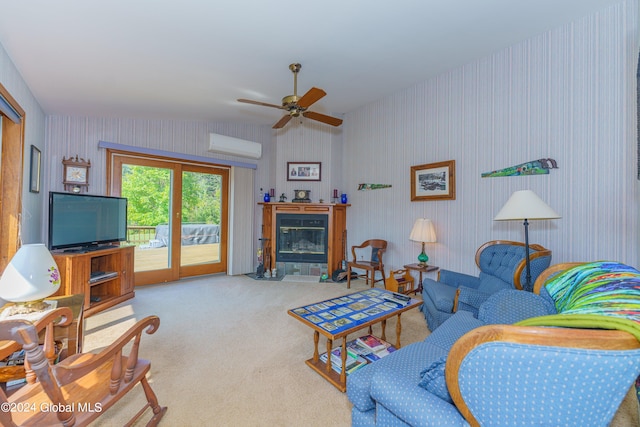 living area featuring wallpapered walls, carpet, a glass covered fireplace, and ceiling fan