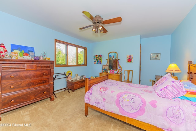 bedroom featuring ceiling fan and carpet
