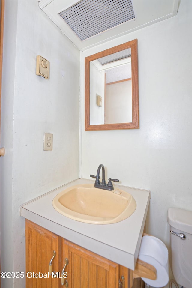 200 Summit Lake Rd, Argyle, NY 12809 - half bathroom with visible vents, vanity, and toilet