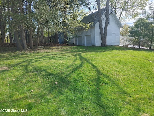 view of yard featuring a garage