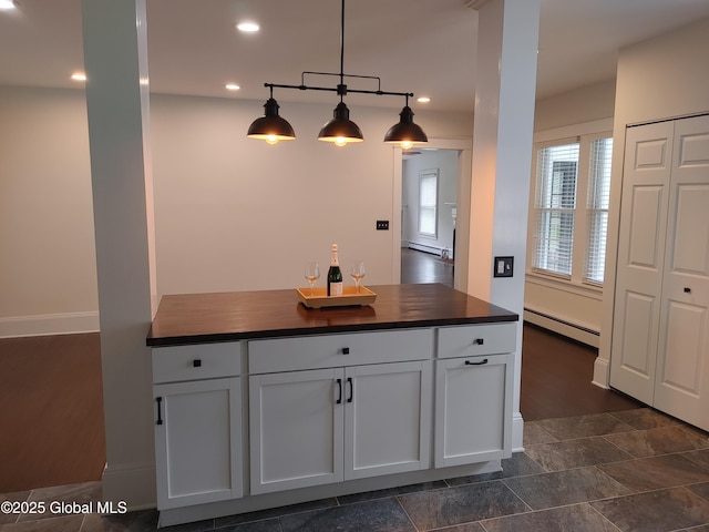 6 Father Jogues Pl, Ticonderoga, NY 12883 - kitchen featuring baseboard heating, butcher block counters, a baseboard heating unit, white cabinetry, and recessed lighting