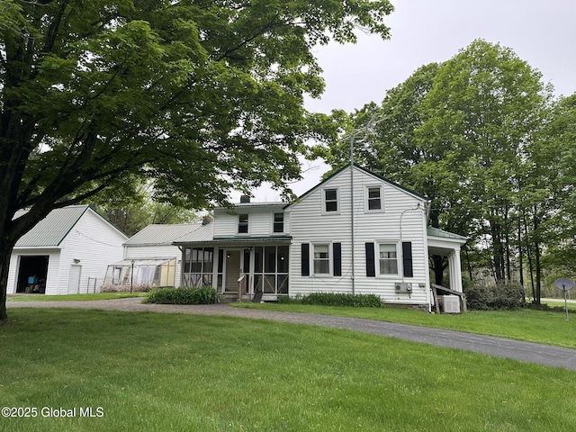 view of front of home featuring a porch, a front yard, and central air condition unit