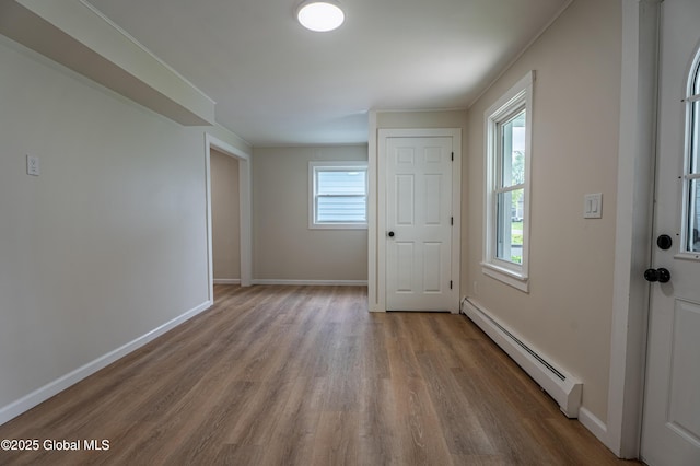 65 N Main St, Voorheesville, NY 12186 - entrance foyer featuring a baseboard radiator and wood finished floors