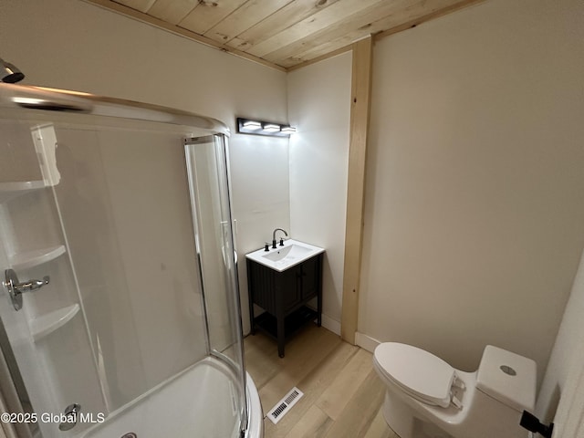 bathroom featuring toilet, wood ceiling, a stall shower, visible vents, and wood finished floors