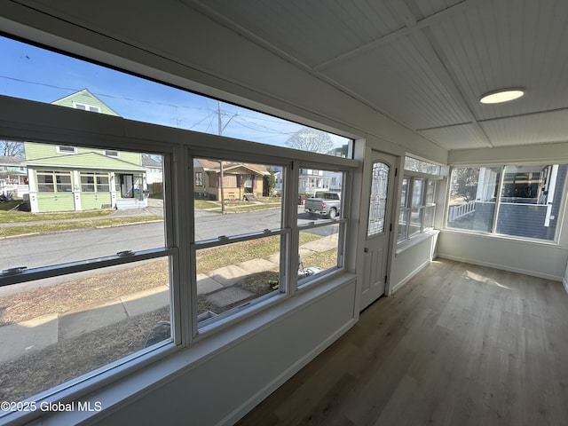 unfurnished sunroom with a wealth of natural light