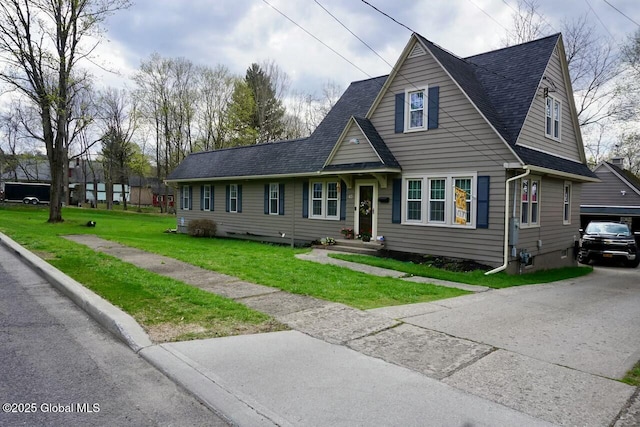 view of front of house featuring roof with shingles and a front lawn