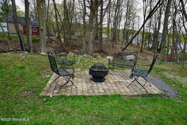 view of yard with a fire pit and a patio area