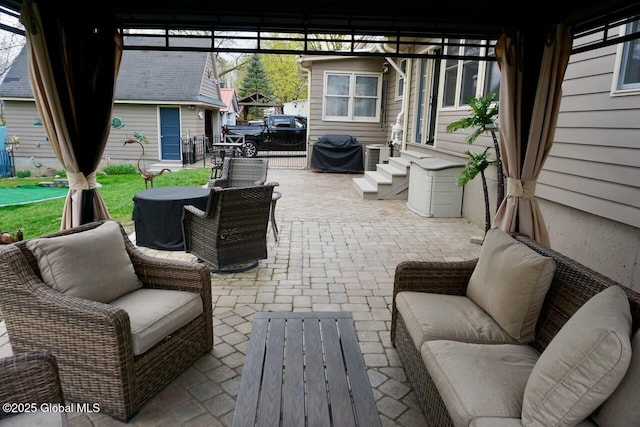 view of patio / terrace with a grill and entry steps
