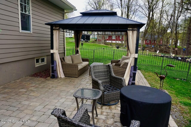 view of patio / terrace with fence and a gazebo