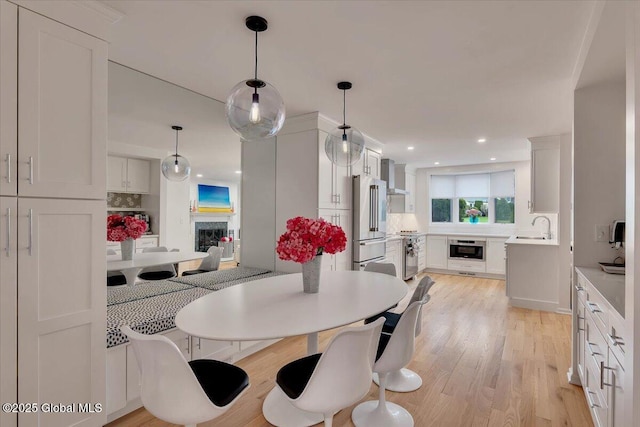 101 Kaydeross Park Rd, Saratoga Springs, Outside, NY 12866 - dining area featuring a fireplace, light wood-type flooring, and recessed lighting