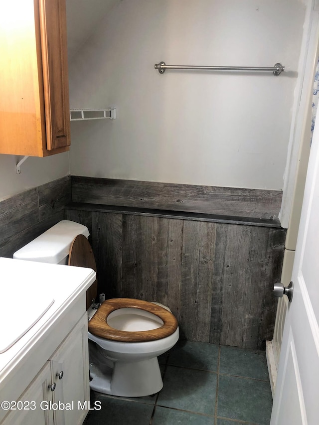 bathroom featuring toilet, tile patterned floors, and vanity