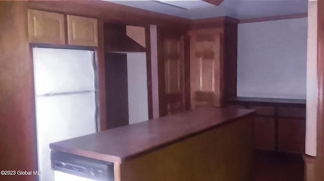 kitchen featuring freestanding refrigerator