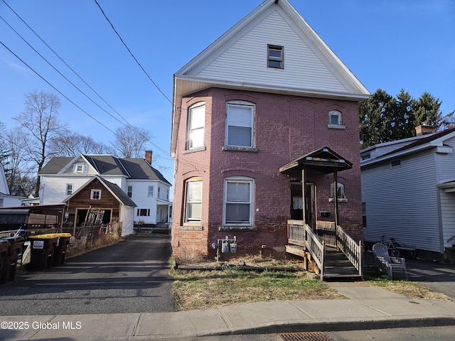 view of front of house with brick siding