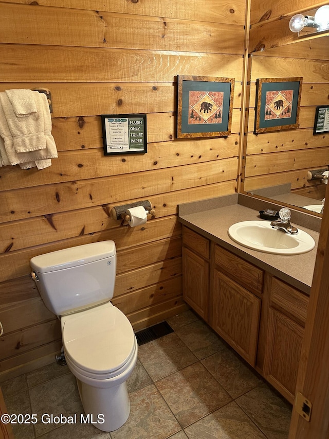 3210 Lake Shore Dr Unit 24Interval 2, Lake George, NY 12845 - bathroom with toilet, visible vents, wooden walls, and vanity