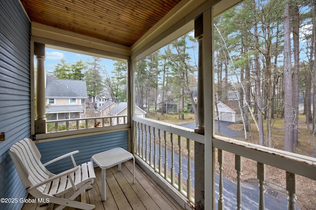 wooden terrace with a residential view