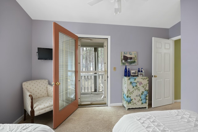carpeted bedroom with baseboards, a ceiling fan, and access to exterior