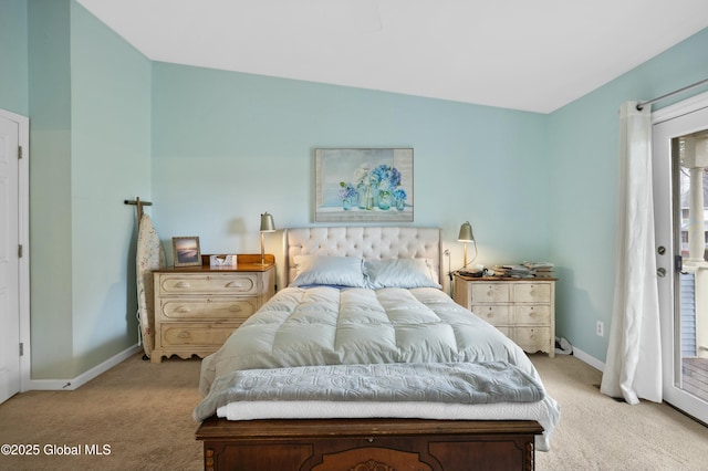 carpeted bedroom with vaulted ceiling, access to exterior, and baseboards