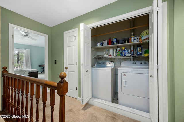 laundry area featuring light carpet, washer and clothes dryer, laundry area, and ceiling fan