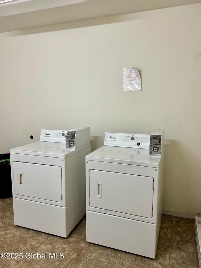laundry area with tile patterned floors, separate washer and dryer, and laundry area