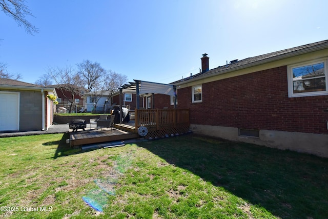 view of yard featuring a fire pit, a pergola, and a deck