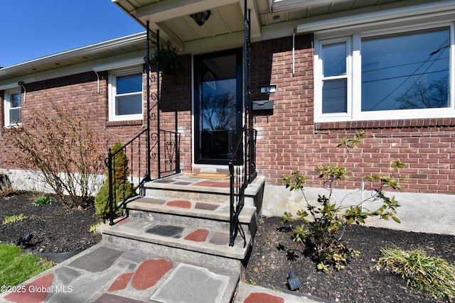 entrance to property with brick siding