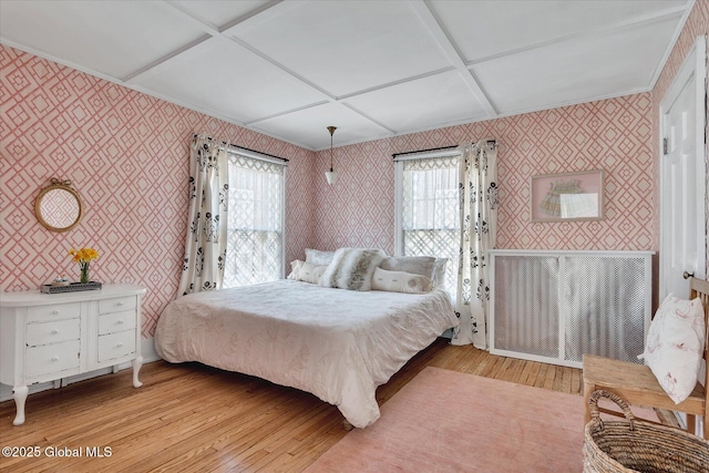 39 5th Ave, Saratoga Springs, NY 12866 - bedroom featuring wallpapered walls, light wood-style flooring, and coffered ceiling