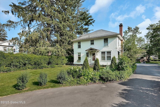 39 5th Ave, Saratoga Springs, NY 12866 - american foursquare style home featuring a chimney and a front yard
