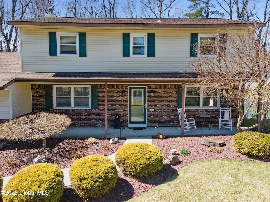 5 Cherry Hills Ct, Clifton Park, NY 12065 - view of front facade featuring brick siding and a porch
