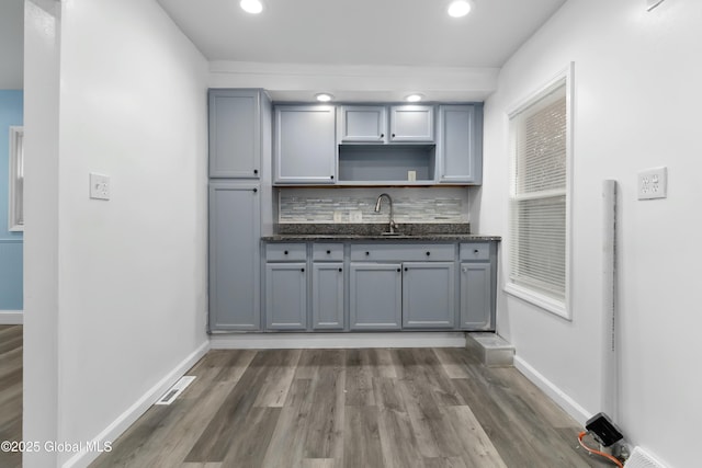 7 Arch Ave, Bethlehem, NY 12203 - kitchen featuring a sink, gray cabinetry, and wood finished floors