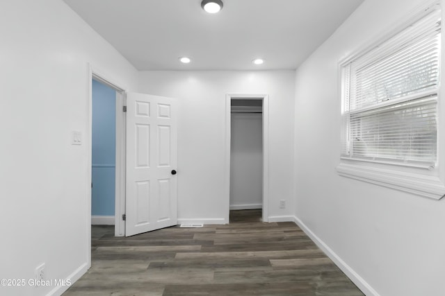 7 Arch Ave, Bethlehem, NY 12203 - unfurnished bedroom featuring a closet, recessed lighting, dark wood-style floors, and baseboards