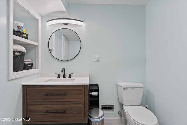 419 Brownell Rd, Malta, NY 12020 - half bath featuring visible vents, toilet, vanity, and baseboards