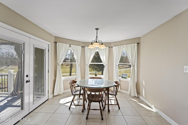 419 Brownell Rd, Malta, NY 12020 - dining area featuring baseboards, an inviting chandelier, and light tile patterned flooring